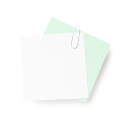 Sticky notes with paper clip on white background