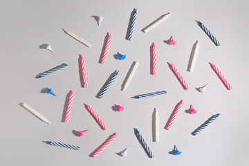 Colorful birthday candles on grey background
