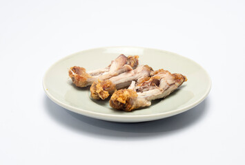 Fried chicken bones on a plate