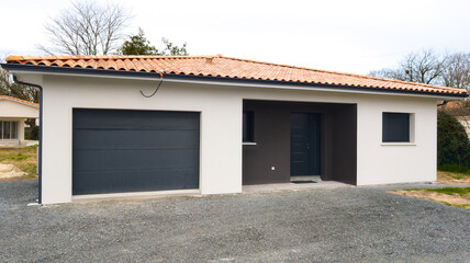 aluminum black dark grey door windows garage facade modern new house front entrance of suburban white home building