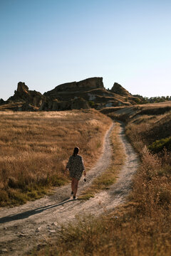 Solo Walk Through Golden Fields and Rocky Terrain in Cappadocia