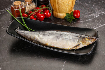Whole raw salted herring fish