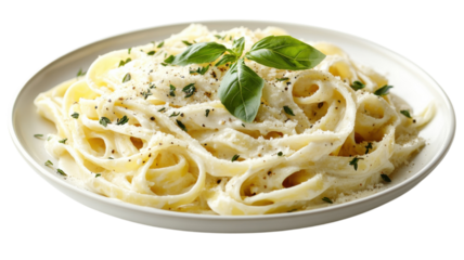 Creamy fettuccine alfredo garnished with fresh basil on a rustic white plate