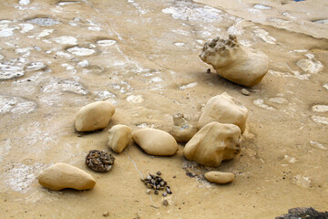 Limestone boulder cliffs on the eroded coast of Xlendi, Gozo, Malta  