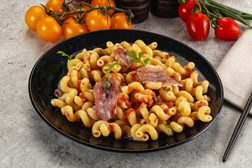 Italian pasta cellentani with anchovy