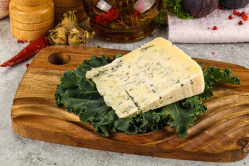 Blue cheese piece over board