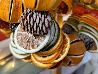 A selection of dried citrus fruits with fircone