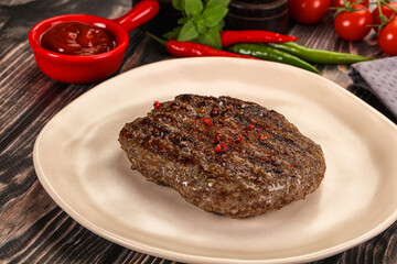 Grilled beef burger cutlet with sauce