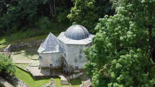 Circular drone shot above Demir Baba Teke, a religious site of Turkish origin located in Bulgaria.