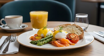 Delicious Eggs Benedict Breakfast with Salmon Asparagus and Orange Juice
