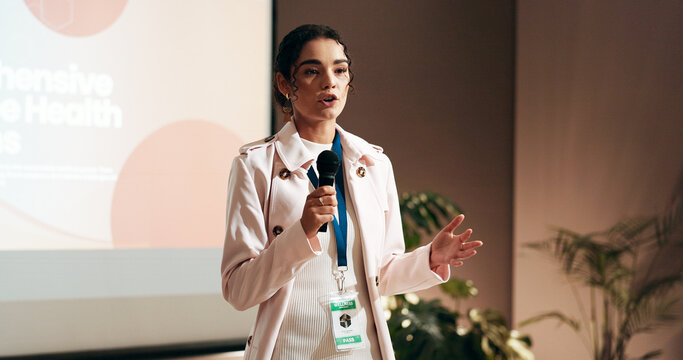 Business woman, workshop or speech for speaker in conference room for health seminar. Education, forum presentation and microphone with corporate coach on stage for public relations or development