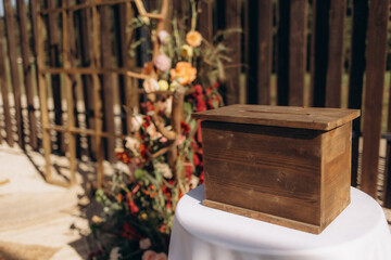 Rustic Wooden Box on Wedding Decoration Table Outdoors