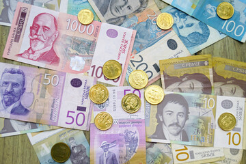 Serbian money: coins and banknotes on the surface in denominations of 10 (ten), 50 (fifty), 100 (one hundred) and 200 (two hundred) dinars. Travel to Belgrade: the national currency of Serbia.