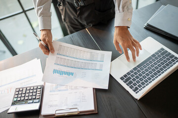 Auditor or internal revenue service staff, Business men checking annual financial statements of...