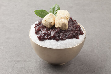  Patbingsu is a food made by crushing ice into small pieces and adding boiled red beans or sugar.