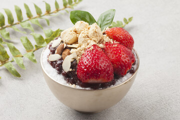  Patbingsu is a food made by crushing ice into small pieces and adding boiled red beans or sugar.