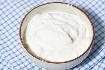 thick greek yogurt in a white bowl
