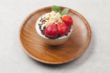  Patbingsu is a food made by crushing ice into small pieces and adding boiled red beans or sugar.