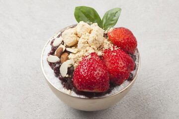 Patbingsu is a food made by crushing ice into small pieces and adding boiled red beans or sugar.