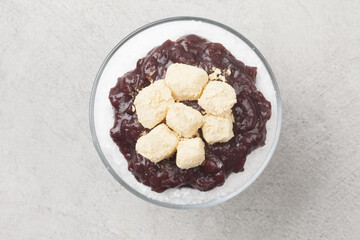  Patbingsu is a food made by crushing ice into small pieces and adding boiled red beans or sugar.