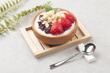  Patbingsu is a food made by crushing ice into small pieces and adding boiled red beans or sugar.