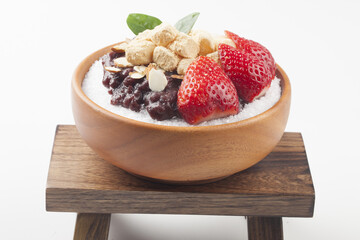  Patbingsu is a food made by crushing ice into small pieces and adding boiled red beans or sugar.