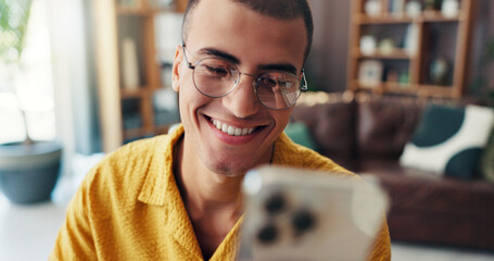 Happy, laughing and man with phone in home for online joke, social media and internet post....