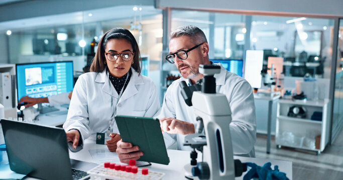 Collaboration, tablet or science with people in lab together for research or development. Innovation, tech and microscope with scientist team in clinical trial for planning or medical investigation