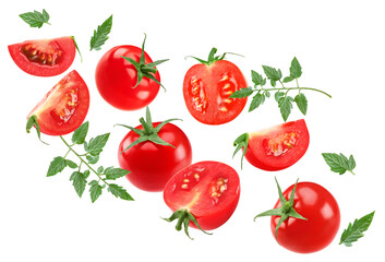 flying fresh tomatoes with green leaves isolated on white background. clipping path