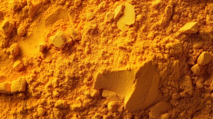 Scattered turmeric powder pile, top view --ar 16:9