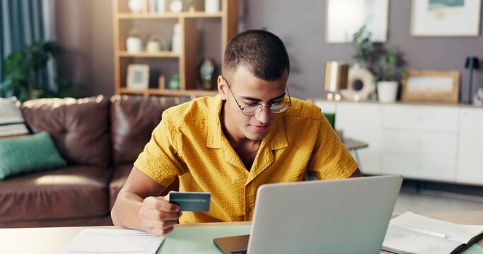 Man, laptop and online shopping with credit card for banking, payment or purchase at home. Male person, shopper or remote buyer with computer for wireless transaction, debit app or ecommerce at house