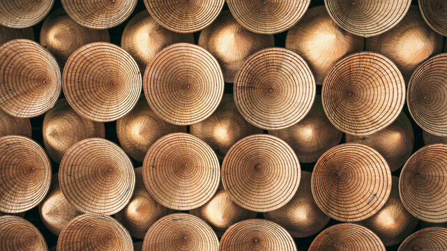 The ceiling is decorated with traditional national Vietnamese Non La hats. Background of bamboo cone hats