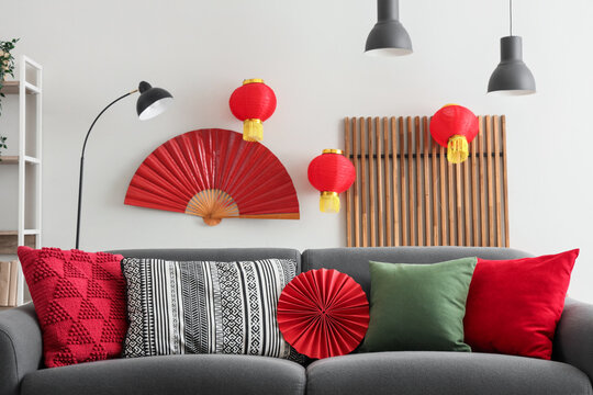 Interior of living room with sofa and decor for Chinese New Year celebration