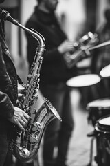 Obraz premium A musician playing saxophone on stage with a band, suitable for music-related images and projects