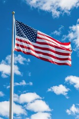 Obraz premium Large American flag flying high in the sky, suitable for patriotic events and celebrations