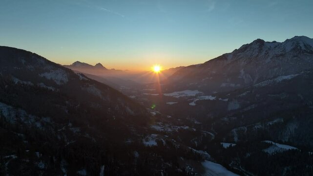 Drone footage of a colorful sunrise in a quiet valley of the Austrian Alps shot in 4k at 60fps.