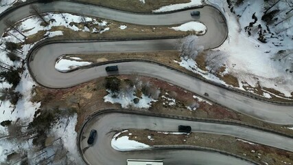 Drone video directly over the winding roads of the dolomites in northern Italy and the alps.