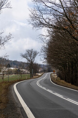 Asphalt road going into the distance. Poland.