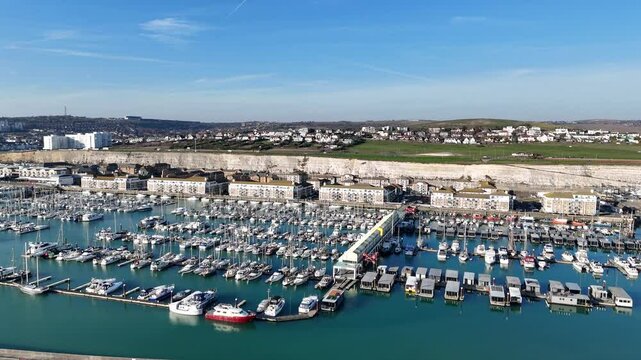 Brighton Marina East Sussex UK blue sky pull back drone aerial reverse reveal