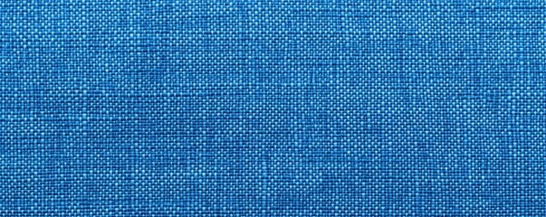 A close-up of textured blue fabric showcasing a woven pattern, emphasizing depth and color richness, Denim Texture woven  seamless.