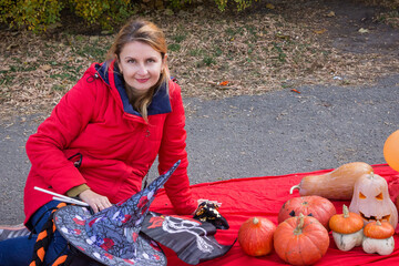 woman, brown hair, smiles, sitting, pumpkins, red- jacket, plaid, decorations, decorations,...