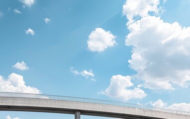 Obraz premium Unfinished Concrete Bridge Structure Against Cloudy Blue Sky