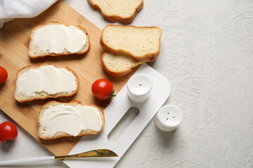 Cutting board of tasty bruschetta with processed cheese and fresh tomatoes on grey background. Top view