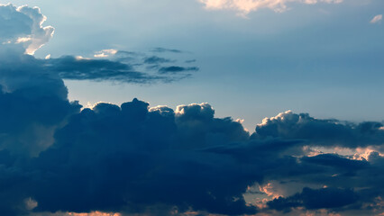 Awesome sunset and soft pink clouds of pastel tones. Image template of textured sky. Bright epic sky. Dramatic evening light and fiery orange sunset.