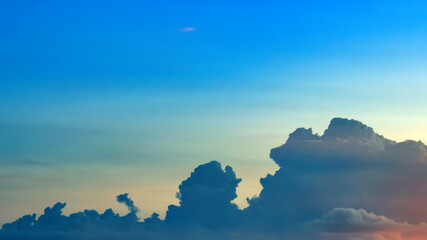 Awesome sunset and soft pink clouds of pastel tones. Image template of textured sky. Bright epic sky. Dramatic evening light and fiery orange sunset.