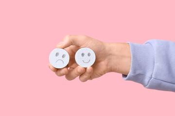 Man holding rating smiles on pink background. Survey concept
