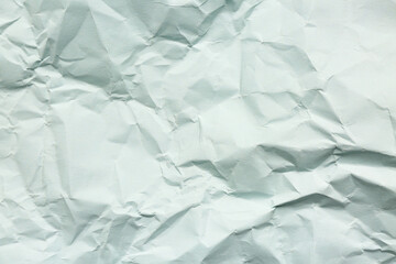 Texture of crumpled blue paper as background
