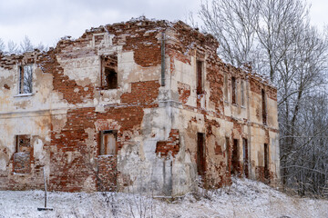 Withered Grandeur: The Ruins of a Brick Estate in Winter's Embrace