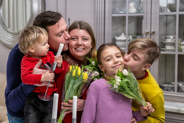 Family Affection: Heartwarming Moment of Love and Celebration with Flowers and Smiles