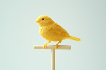 3D bright yellow canary perched on a small wooden stick